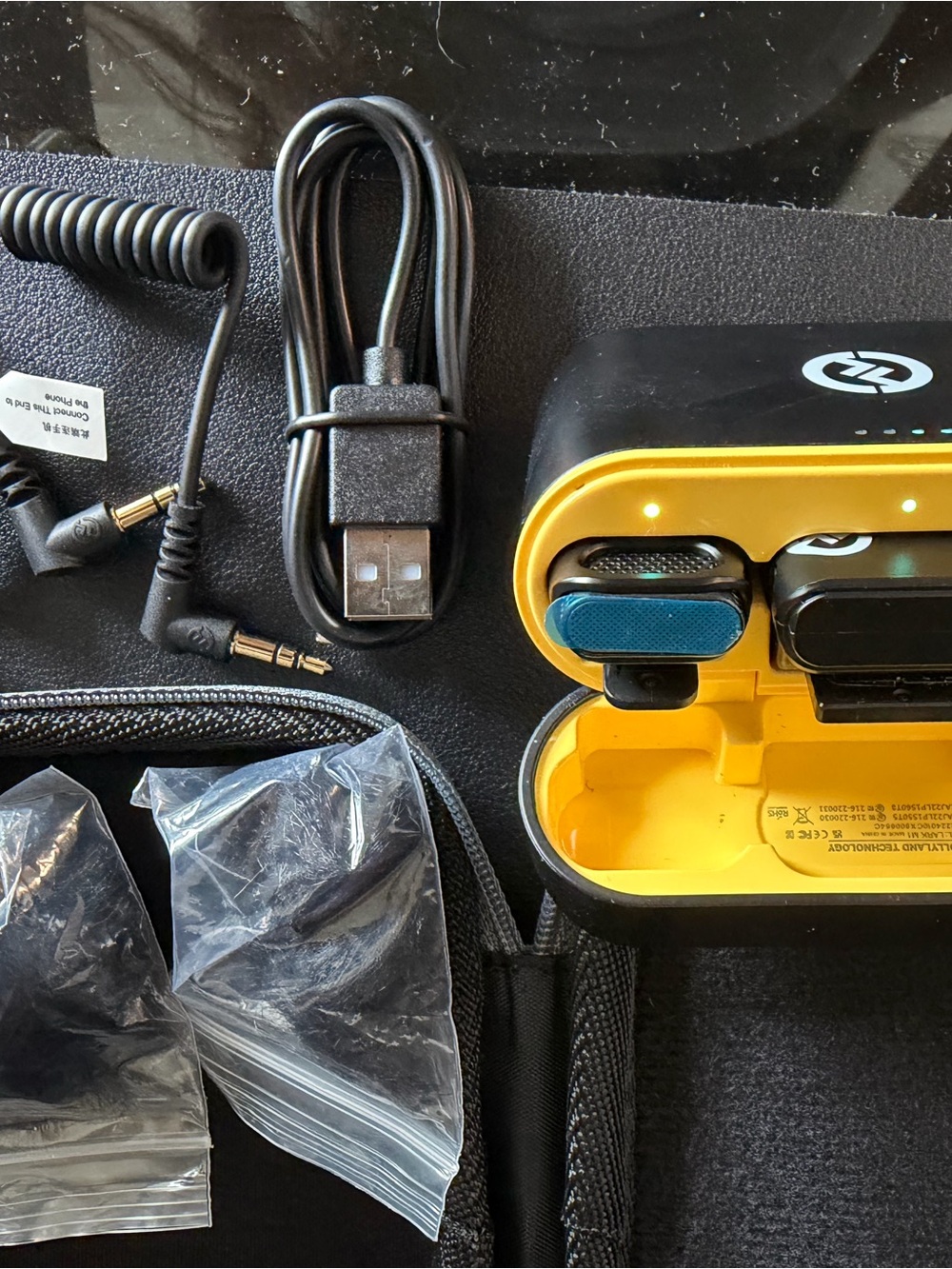 Portable Wireless Microphone with Yellow Charging Case and microphone